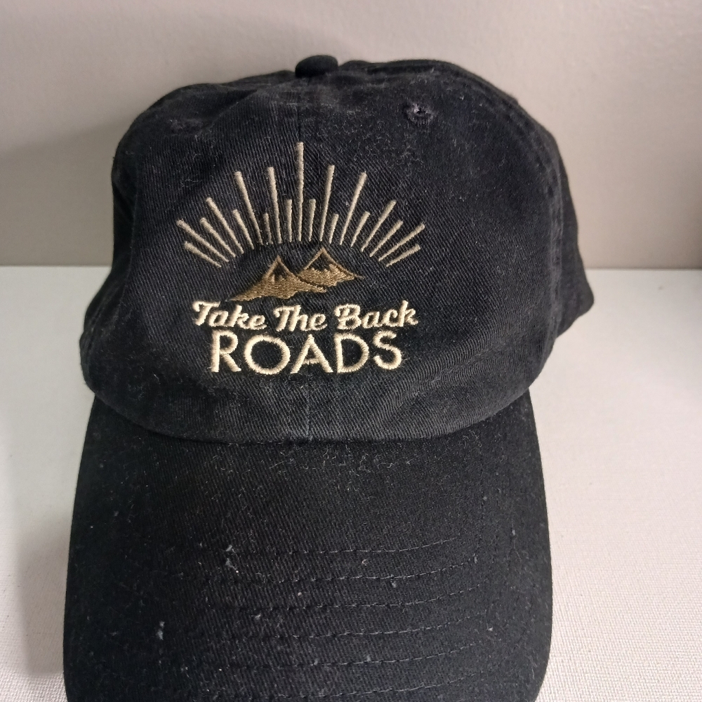 Take the road dad cap, black with white print on front of cap,